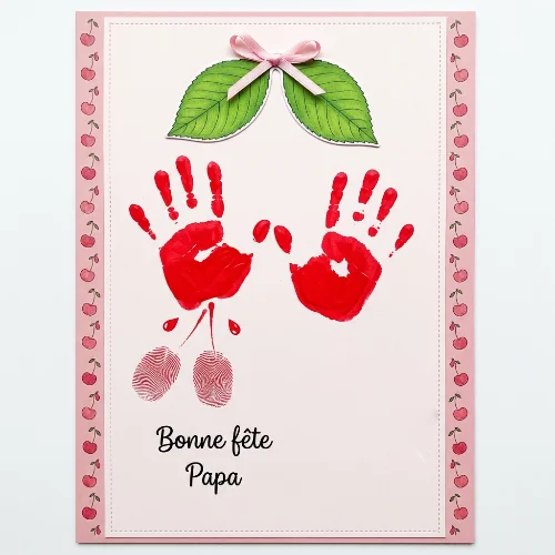 Bricolage fête des pères : réaliser une carte cerises avec empreintes des mains carte fete pere empreintes de mains et cerise 1